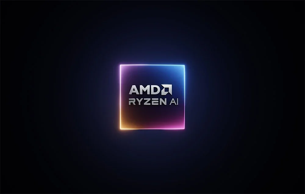AMD Ryzen AI logotipas šviečiančiame rėmelyje juodame fone