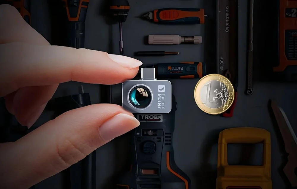 Compact THERMAL MASTER P2 Pro thermal camera beside a one-euro coin